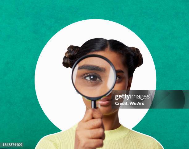 woman looking through magnifying glass - finding customers stock pictures, royalty-free photos & images