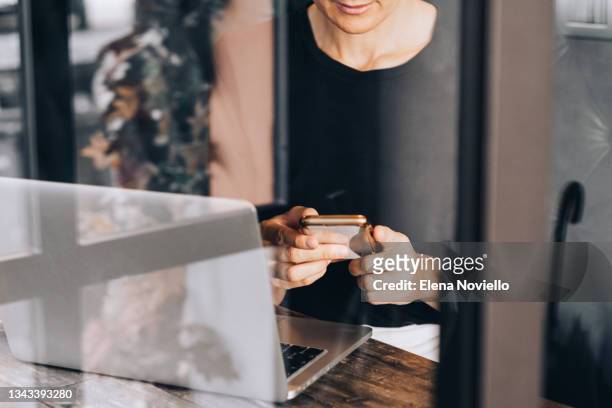 businesswoman hand, working at a café. close up woman using laptop, female hands typing, writing notes, studying languages, distance learning concept, checking email in morning, drink coffee, working at home - reading email stock pictures, royalty-free photos & images