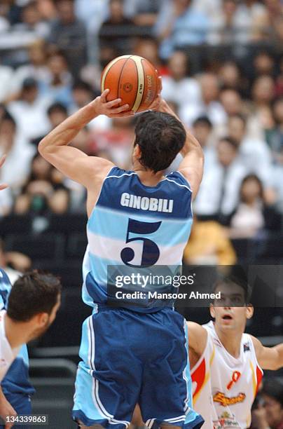 Manu Ginobili makes the jumper as Jose Manuel Calderon of Spain is grounded during the FIBA World Championship 2006 Semi Final at the Saitama Super...