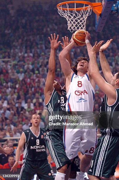 Matjaz Smodis of CSKA Moscow comes up against the defensive duo of Mike Batiste and Dimos Dikoudis of Panathinaikos during the Euroleague Final Four...