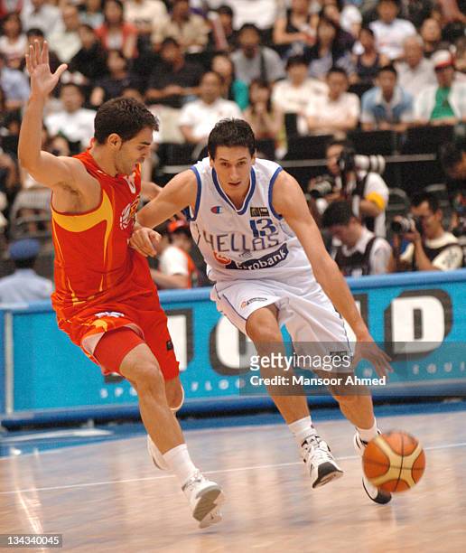 Dimitris Diamantidis of Greece tries to brush off Spaniard defender Jose Manuel Calderon during the FIBA World Championship 2006 Final between Spain...