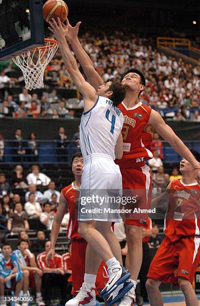 Greek player Theodoros Papaloukas and China's Yao Ming battle along the glass during the Final Eight round of the 2006 FIBA World Championships at...