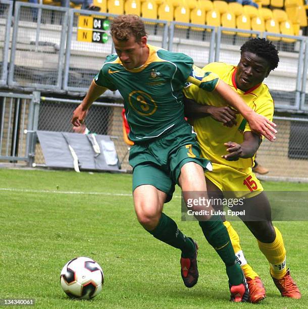 Australia captain Trent McClenahan tries to stop Razak Amotoyossi from regaining possession. The final result was a 1-1 draw at The Parkstad Limburg...