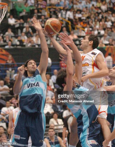 Jose Manuel Calderon of Spain gets past Manu Ginobili of Argentina during the FIBA World Championship 2006 Semi Final at the Saitama Super Arena,...