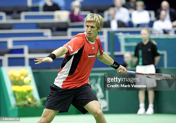 Jarkko Nieminen returns to Christophe Rochus during the semi-finals of the ABN AMRO World Tennis Tournament at the Ahoy' in Rotterdam, the...