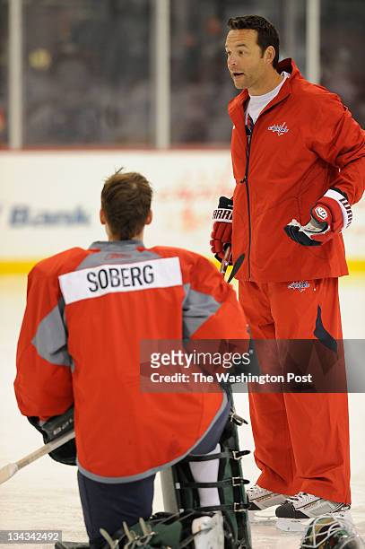 July 13: Steffen Soberg, bottom left, listens with others as associate goaltender coach for the Washington Capitals, Olie Kolzig, right, gives...