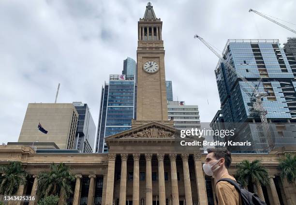 People are seen wearing masks in the Brisbane CBD on September 28, 2021 in Brisbane, Australia. COVID-19 restrictions have been reintroduced for the...