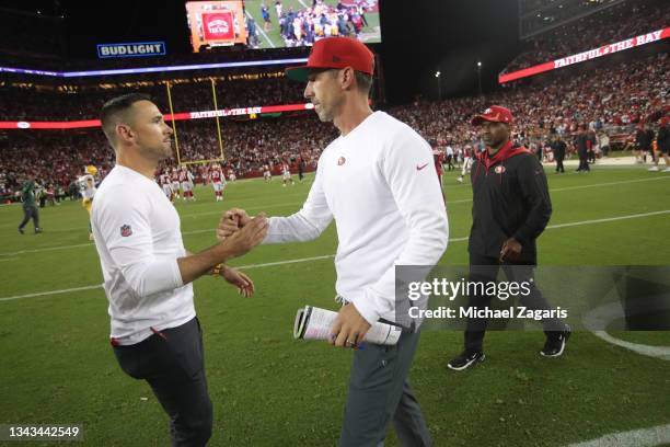 Head Coach Matt LaFleur of the Green Bay Packers and Head Coach Kyle Shanahan of the San Francisco 49ers shake hands on the field after the game at...