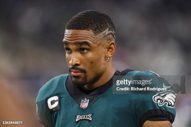 Jalen Hurts of the Philadelphia Eagles looks on while playing the Dallas Cowboys at AT&T Stadium on September 27, 2021 in Arlington, Texas.