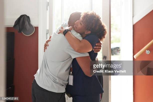 caregiver and man embracing each other - introducing boyfriend stock pictures, royalty-free photos & images
