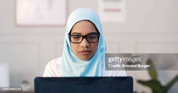 shot of a young female doctor using her laptop in her office - ethical treatment stock pictures, royalty-free photos & images