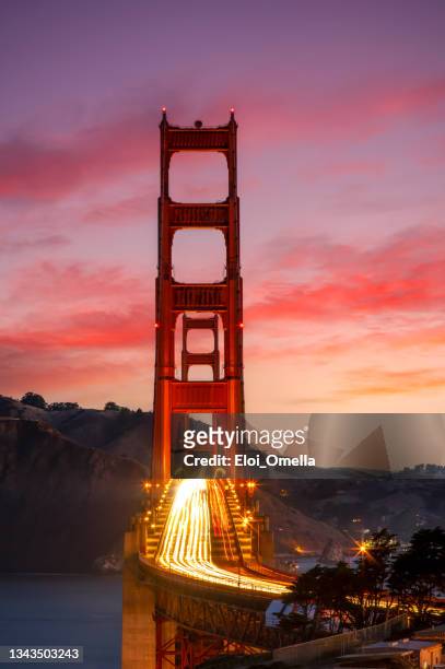 car trails at golden gate bridge, san francisco, california, usa - red car wire stock pictures, royalty-free photos & images