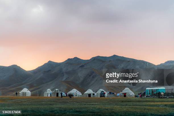 dramatic view of the colorful summer landscape in the mountain yurt camp of central asia - kyrgyzstan stock pictures, royalty-free photos & images