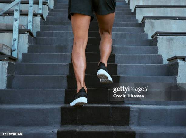 shot of a man walking up the staircase at a track and field - beautiful male feet stock pictures, royalty-free photos & images