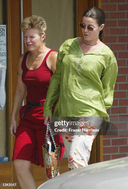 Former WWF wrestling star Chyna Joanie Laurer walks with an unidentified friend on August 16, 2002 in Beverly Hills, California.
