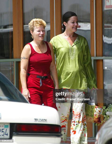 Former WWF wrestling star Chyna Joanie Laurer walks with an unidentified friend on August 16, 2002 in Beverly Hills, California.