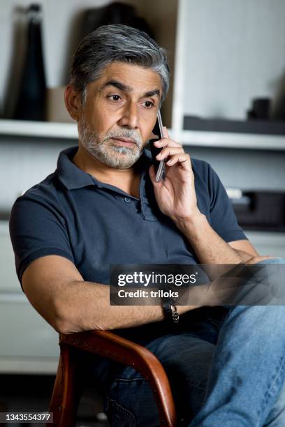 man talking on mobile phone - one mature man only stock pictures, royalty-free photos & images