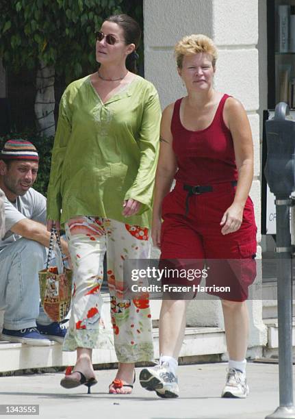 Former WWF wrestling star Chyna Joanie Laurer walks with an unidentified friend on August 16, 2002 in Beverly Hills, California.