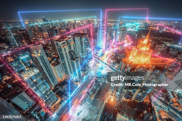 night  cityscape with neon light and  futuristic digital design - city street night background stock pictures, royalty-free photos & images