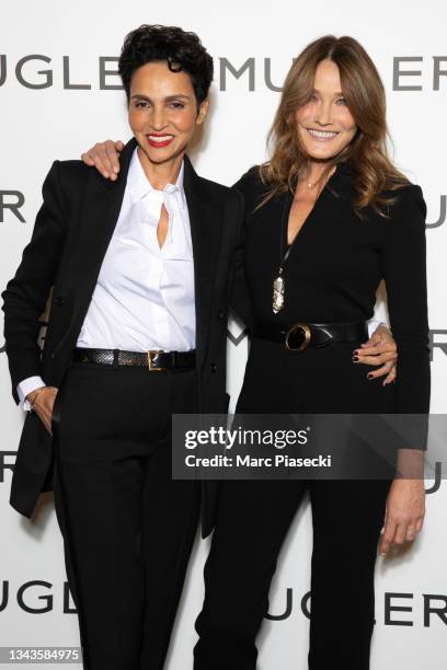 Farida Khelfa and Carla Bruni Sarkozy attend the "Thierry Mugler : Couturissime" Photocall as part of Paris Fashion Week at Musee Des Arts Decoratifs...