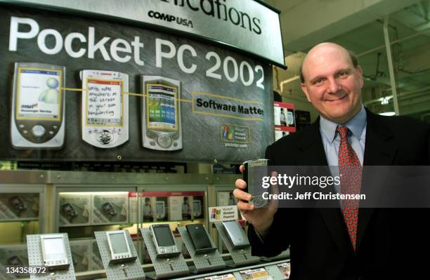 Steve Ballmer, CEO of Microsoft holds a new Compaq pocket PC at the CompUSA store in San Francisco, October 4, 2001. Ballmer announced the...