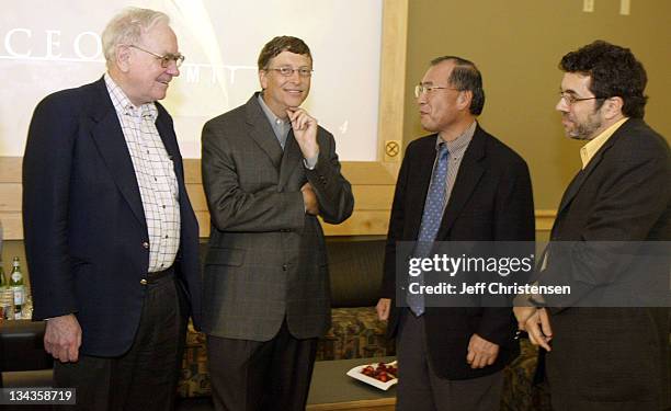 Microsoft chairman and chief software architect Bill Gates talks to Warren Buffett Chairman, Berkshire Hathaway Inc., Atsutoshi Nishida, Executive...
