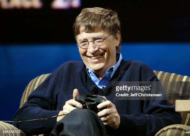 Bill Gates, chairman and chief software architect of Microsoft Corp. Laughs as he plays an Xbox car racing game against talk show host Conan O'Brien...