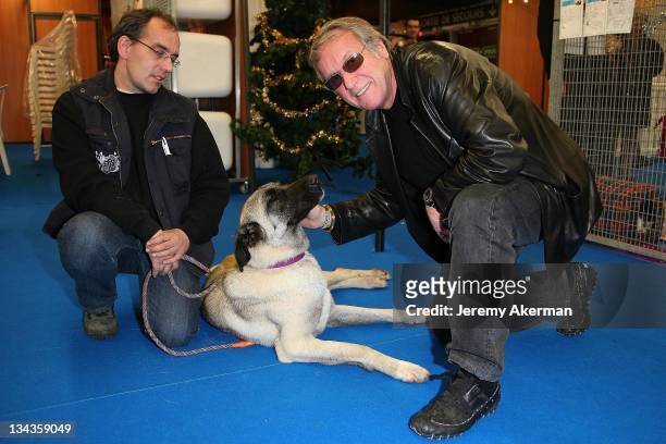 Yves Renier and an unidentified guest attend the SPA Christmas at l'espace Champerret on December 1, 2007 in Paris France.