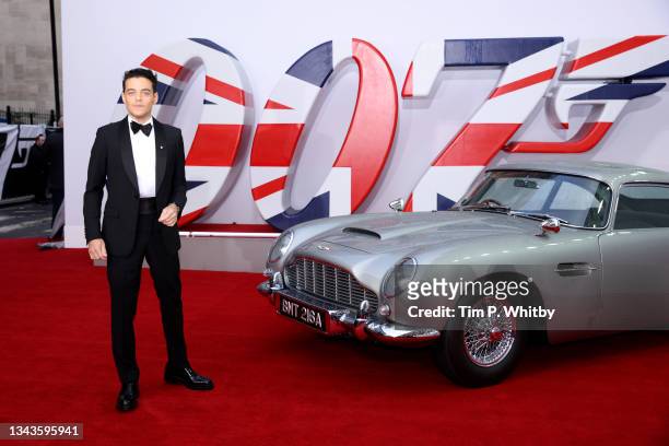 Rami Malek with James Bonds Aston Martin car at the World Premiere of "NO TIME TO DIE" at the Royal Albert Hall on September 28, 2021 in London,...