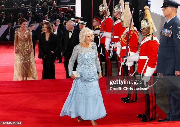 Camilla, Duchess of Cornwall, Prince William, and Catherine, Duchess of Cambridge attend the "No Time To Die" World Premiere at Royal Albert Hall on...