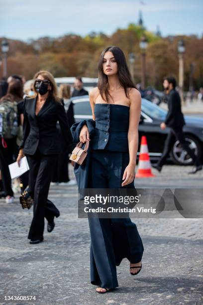 Deva Cassel is seen wearing navy off shoulder top, wide leg pants, Dior bag outside Dior on September 28, 2021 in Paris, France.