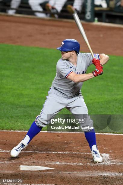 Brock Holt of the Texas Rangers prepares for a pitch during a baseball game against the Baltimore Orioles at Oriole Park at Camden Yards on September...