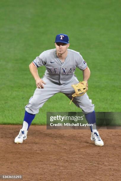 Brock Holt of the Texas Rangers in position during a baseball game against the Baltimore Orioles at Oriole Park at Camden Yards on September 24, 2021...