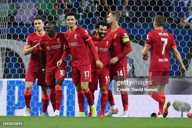 Mohamed Salah of Liverpool celebrates with team mates Jordan Henderson, Curtis Jones and Sadio Mane after scoring their sides first goal during the...