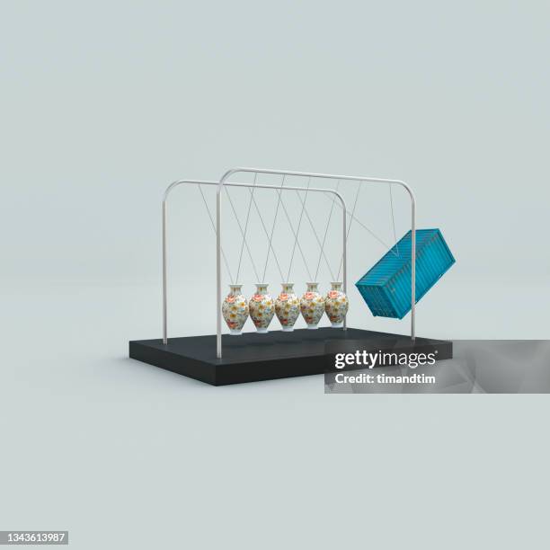 newton's cradle made of porcelain vases almost hit by a cargo container - consumer spending power weakens bildbanksfoton och bilder