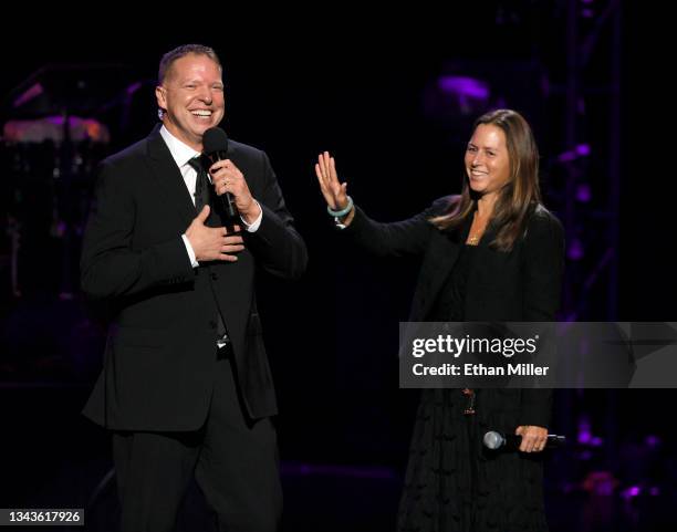 Actor/comedian and host Gary Owen jokes with Turn up for Recovery founder Melia Clapton during Mobile Recovery's Recover Out Loud concert at the...