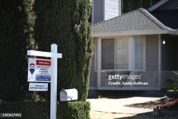 Sign is posted in front of a home for sale on September 28, 2021 in San Rafael, California. According to a report by S&P CoreLogic Case-Shiller, a...