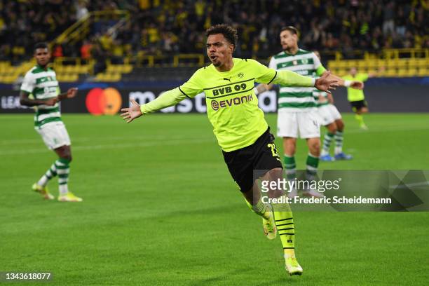 Donyell Malen of Borussia Dortmund celebrates after scoring their sides first goal during the UEFA Champions League group C match between Borussia...