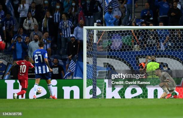 Sadio Mane of Liverpool scores their side's second goal past Diego Costa of FC Porto during the UEFA Champions League group B match between FC Porto...