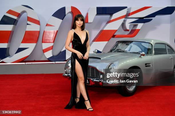 Ana De Armas stands next to James Bond Aston Martin Car at the World Premiere of "NO TIME TO DIE" at the Royal Albert Hall on September 28, 2021 in...