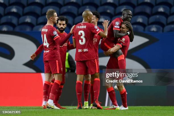 Sadio Mane of Liverpool celebrates with team mate James Milner after scoring their sides second goal during the UEFA Champions League group B match...