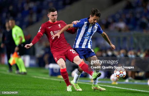 Fabio Vieira of FC Porto competes for the ball with Andrew Robertson of Liverpool FC during the UEFA Champions League group B match between FC Porto...