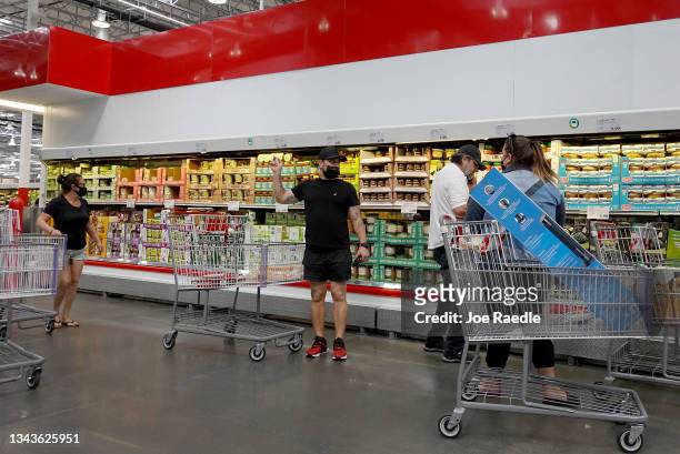 Consumers shop in a Costco store on September 28, 2021 in Miami, Florida.The Conference Board's Consumer Confidence Index released today indicated...