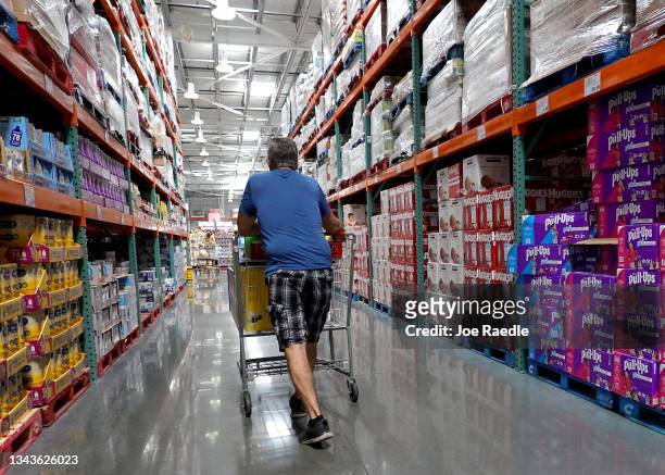 Consumer shops in a Costco store on September 28, 2021 in Miami, Florida.The Conference Board's Consumer Confidence Index released today indicated...