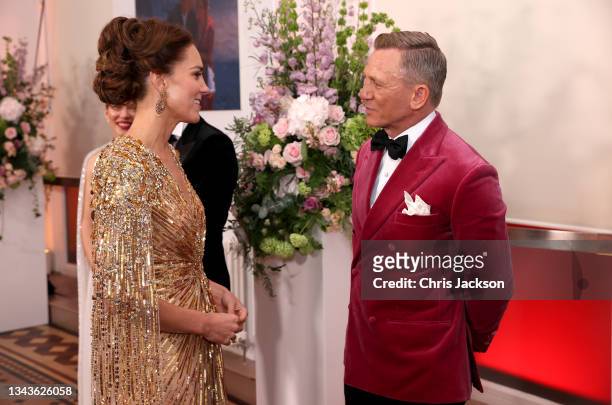 Catherine, Duchess of Cambridge meets actor Daniel Craig as she attends the "No Time To Die" World Premiere at Royal Albert Hall on September 28,...