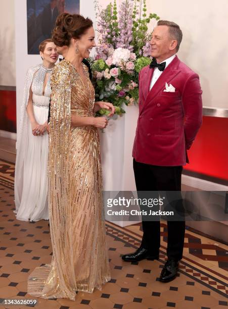 Catherine, Duchess of Cambridge meets actor Daniel Craig as she attends the "No Time To Die" World Premiere at Royal Albert Hall on September 28,...