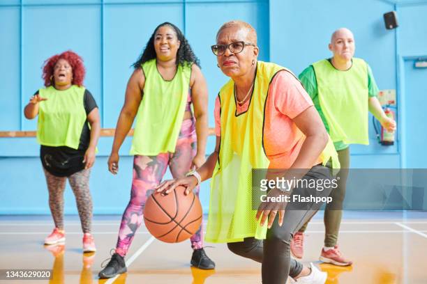 women playing basketball - sportbegriff stock-fotos und bilder