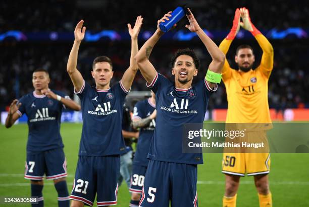 Marquinhos of Paris Saint-Germain applauds the fans following victory in the UEFA Champions League group A match between Paris Saint-Germain and...