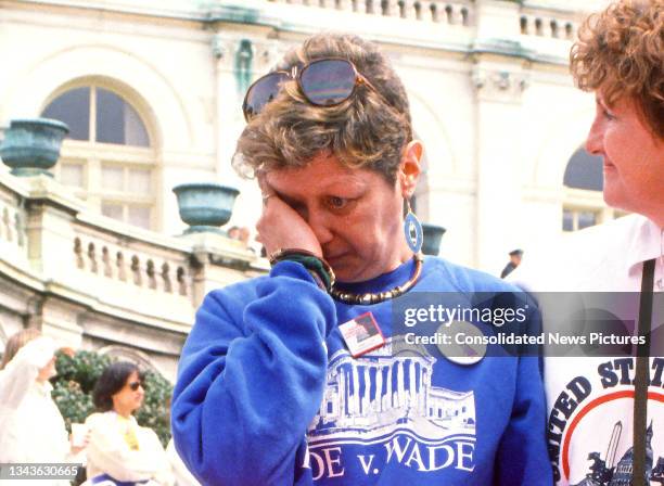 American activist Norma McCorvey rubs her eye as she attends the March for Women's Lives outside the US Capitol, Washington DC, April 9, 1989. Known...