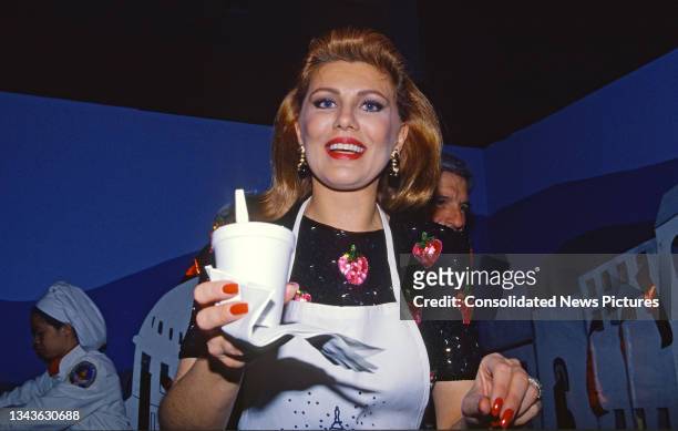 American business executive Georgette Mosbacher offers a cup of chili during the seventh annual March of Dimes Gourmet Gala at the Sheraton...
